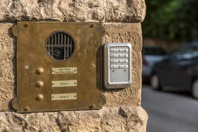 a metal box on a stone wall with a radio at Apartments Villa Anita in Bolzano