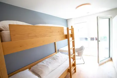 a bunk bed in a room with a window at Residenz Hofer in Naturno