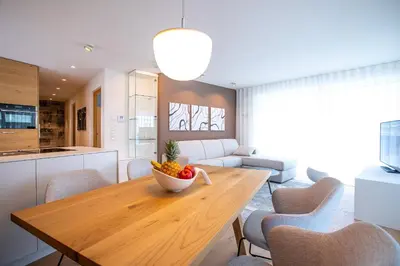 a kitchen with a wooden table with a bowl of fruit on it at Residenz Hofer in Naturno
