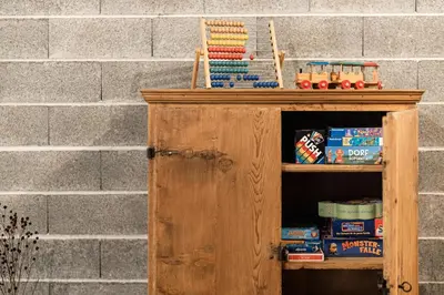 a wooden cabinet with a toy train on top of it at Füchslhof in Marlengo