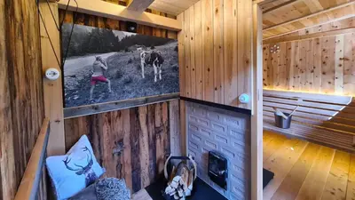 an inside view of a cabin with a picture on the wall at Chalet Passeier - RIVER in Saltusio