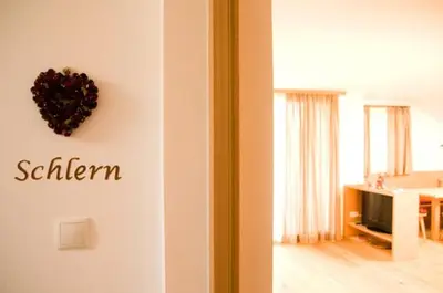 a room with a wall with a heart on a wall at Wegmacherhof in Castelrotto