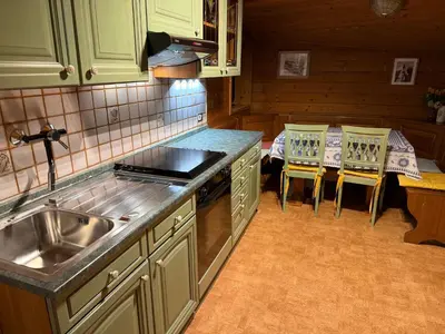 a kitchen with a sink and a stove top oven at Saskia Residence in Ortisei