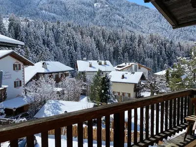 a view from the balcony of a town in the snow at Saskia Residence in Ortisei