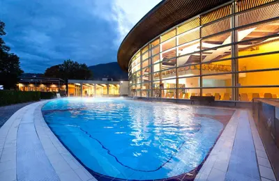 a large swimming pool in front of a building at Residence Isarcus in Bressanone