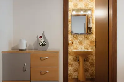 a bathroom with a sink and a toilet and a mirror at Residence Arche Noah - Colfosco in Colfosco
