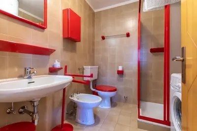 a bathroom with a sink and a toilet at Dimora al Villaggio in Campestrin