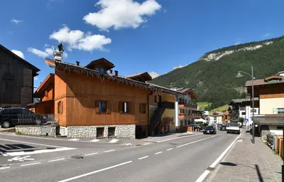 a building on the side of a street with a mountain at Casa De Guidi in Meida