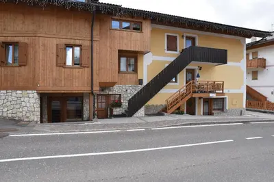 a building with a staircase on the side of the street at Casa De Guidi in Meida