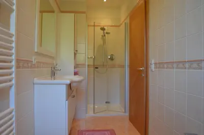 a bathroom with a shower and a sink at Vermietung Obermais in Merano