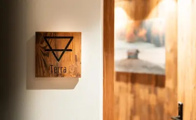 a lightswitch on a wall next to a door at Chalet Insignis in Santa Cristina in Val Gardena