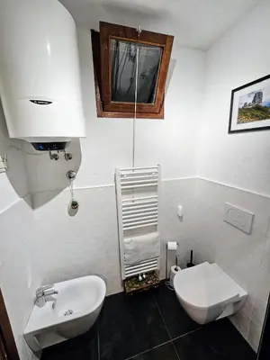 a bedroom with a bed and a tv in it at DaPolo - Cosy appartment in Val di Fassa in Campestrin