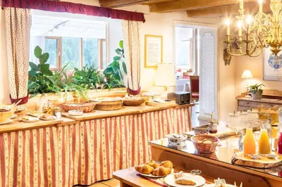 a buffet line with food on it in a restaurant at Berghotel Jochgrimm - Your Dolomites Home in Varena