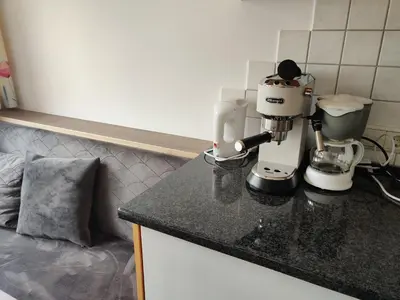a kitchen counter with a mixer on a counter top at Eguia in Selva di Val Gardena