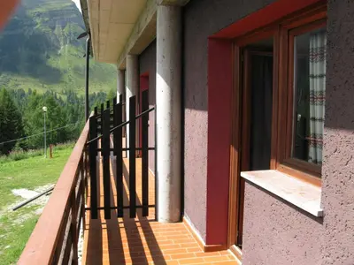a balcony of a building with a window at Casa AQ28 sulle piste da sci in Falcade