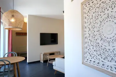 a living room with a large picture frame on the wall at Apartment Plantitsch - Alpstay in Naturno