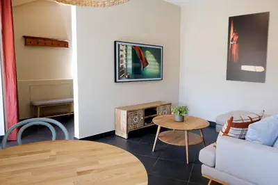 a living room with a couch and a table at Apartment Plantitsch - Alpstay in Naturno