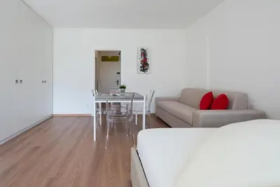 a living room with a couch and a table at Fior Apartments Pienzenau in Merano
