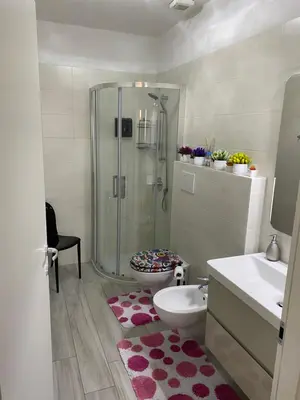 a bathroom with a shower and a toilet and a sink at Manuel's Home 1 FREE parking Wi-Fi AC in Bolzano