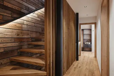 a staircase in a house with wooden walls at Chalet Dolecir in La Valle