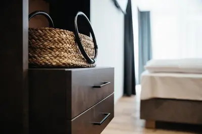 a bedroom with a dresser with a basket on it at Chalet Dolecir in La Valle