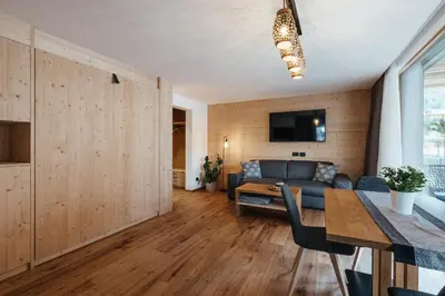 a living room with a couch and a table at Chalet Dolecir in La Valle