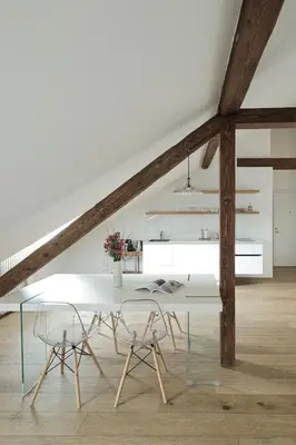 a white dining room with a white table and chairs at Design Apartment in the heart of Bolzano in Bolzano