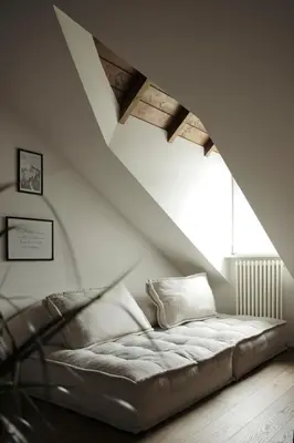 a couch in a room with a large window at Design Apartment in the heart of Bolzano in Bolzano