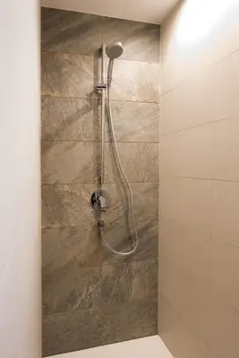 a shower with a shower head in a bathroom at Jaufnerhof in Mareta