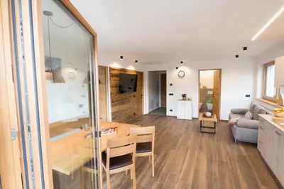 a living room with a table and a couch at Jaufnerhof in Mareta