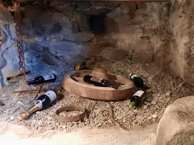 a group of wine bottles laying on the ground at Chalet Passeier - ZOLL in Saltusio