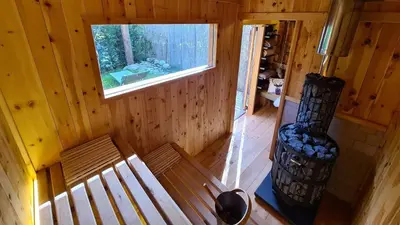 an overhead view of a wooden cabin with a bench and a window at Chalet Passeier - ZOLL in Saltusio