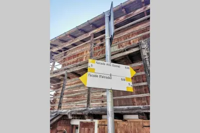 a street sign in front of a building at Casa Bel Vedere in Falcade