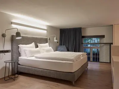 a bedroom with a large bed and a window at Parcloft in Merano