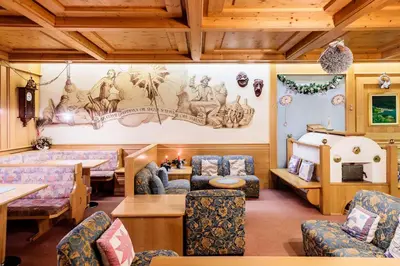 a living room with a couch and a table at Hotel Coldai in Alleghe