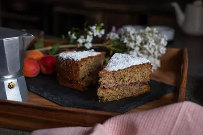a piece of cake on a plate on a table at Ansitz Lidl in Tesimo