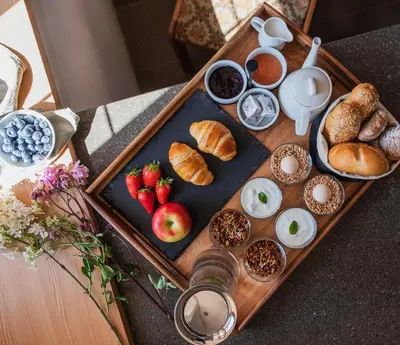 a tray of breakfast foods on a table at Ansitz Lidl in Tesimo