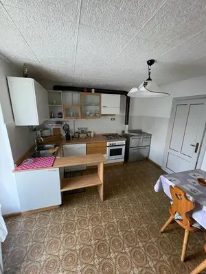 a small kitchen with a table and a table sidx sidx sidx at Casa da Rina in Siror