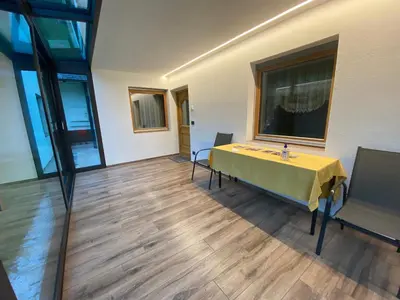 a room with a yellow table and chairs in it at Pradat in La Valle