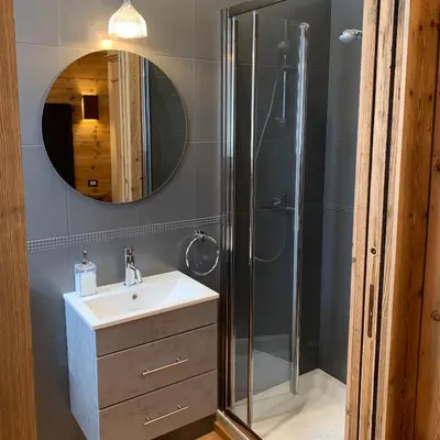 a bathroom with a sink and a shower at Piccolo gioiello di montagna in Villanova