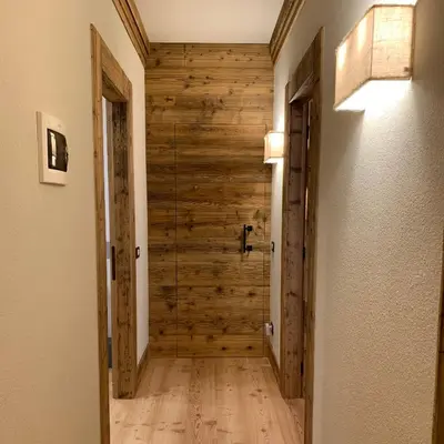 a hallway with wooden walls and a wooden floor at Piccolo gioiello di montagna in Villanova