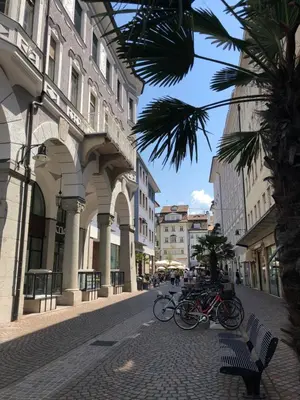 a group of bikes parked on a street next to a building at Apartments Leonardo in Bolzano