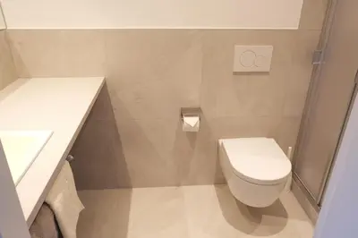 a small bathroom with a toilet and a sink at Apartment Weitblick - Alpstay in Naturno