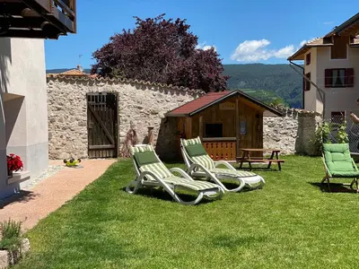 a group of lawn chairs sitting in a yard at RESIDENZA LA CANONICA in Brez