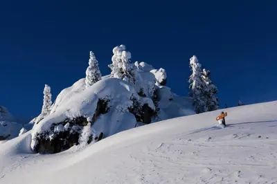 a person standing on top of a snow covered mountain at Pension Angelo in Corvara in Badia