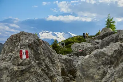 a pile of rocks with a mountain in the background at Pension Angelo in Corvara in Badia