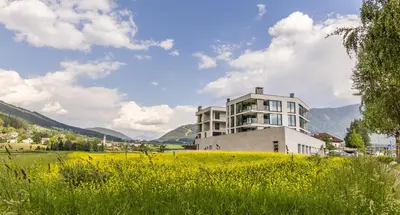 a view of a city with mountains in the background at Bellevue Bruneck - Suites & Lofts in Brunico