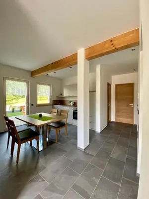 a kitchen and dining room with a table and chairs at Der Söllhof in Bressanone