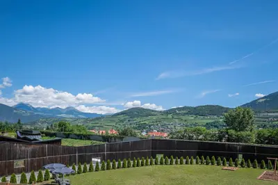 a view of the mountains from the backyard of a house at Der Söllhof in Bressanone