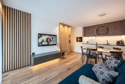 a living room with a couch and a table at Deluxe Appartement Arve in Valdaora